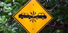 2 cars crashing sign